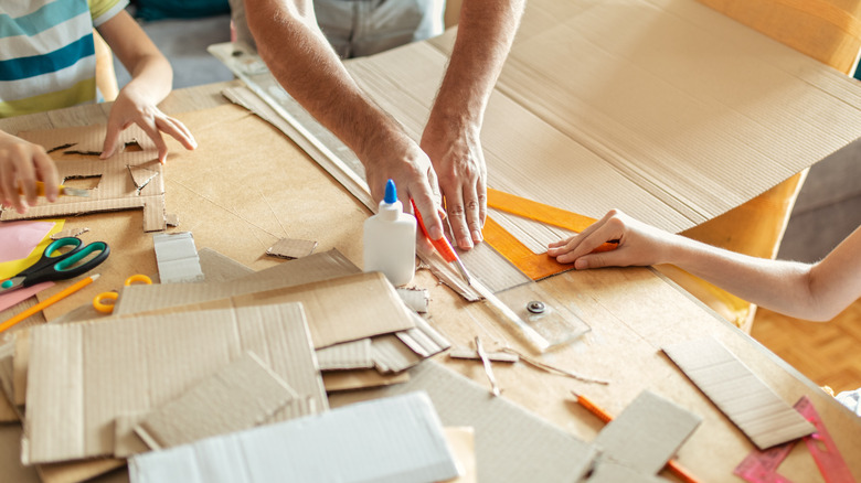 Family cutting cardboard box for a craft