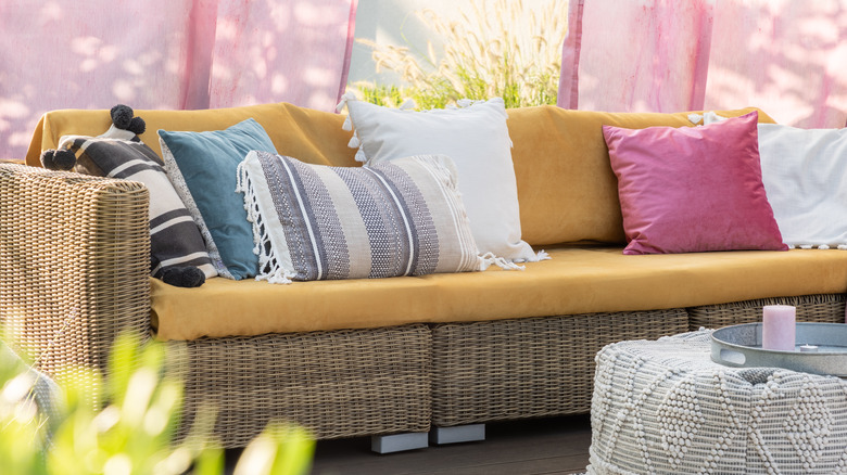 outdoor sofa with pastel pillows