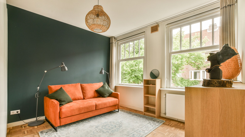 A living room with a blue accent wall