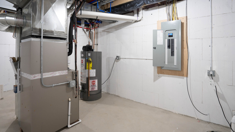 A furnace in a basement with plenty of clear space around it