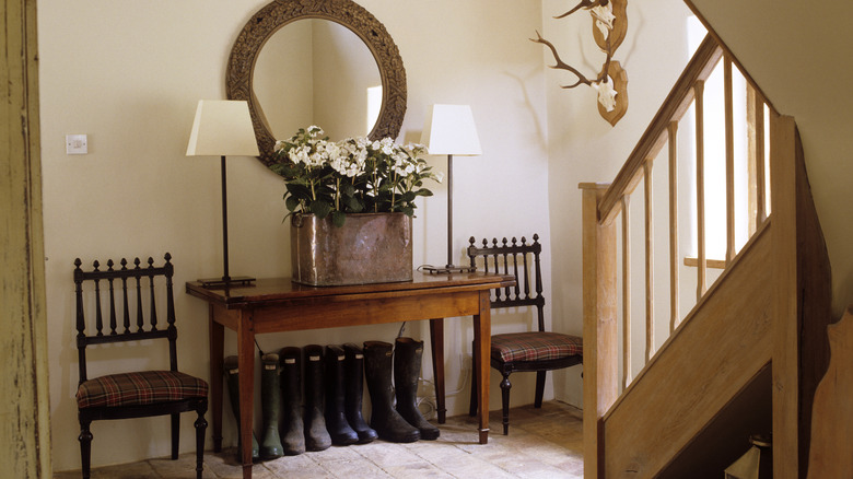 english entryway with console and mirror