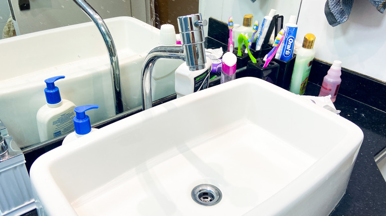 cluttered bathroom counter