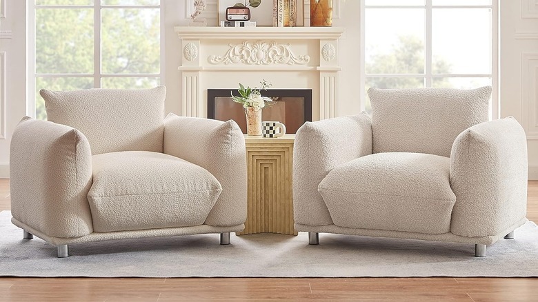 Overstuffed white chairs in a sitting room