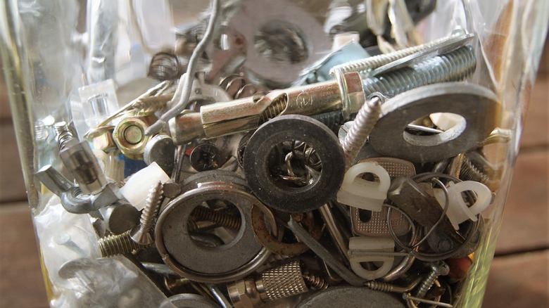 A jar of miscellaneous fasteners