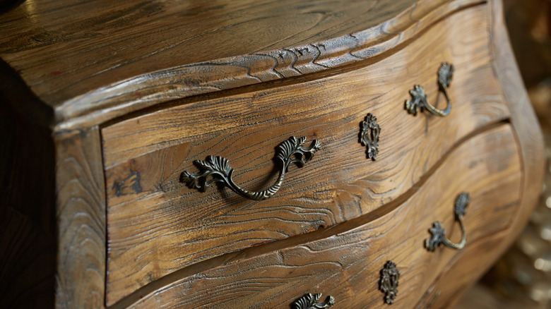 curved wooden dresser