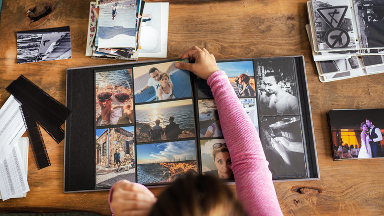 woman organizing photo album