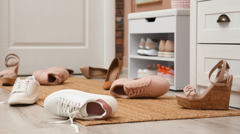 womens shoes scattered on the floor