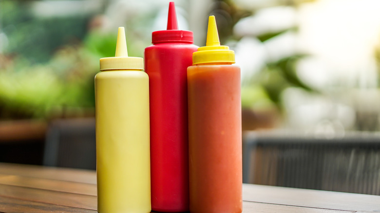 Condiment bottles on table