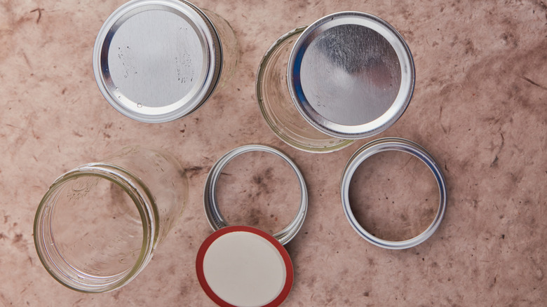 Top view of Mason jars and metal covers.