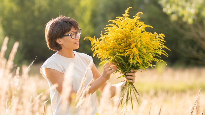 Goldenrod bouquet being held