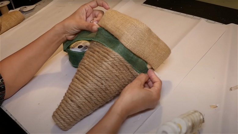 hands making craft basket