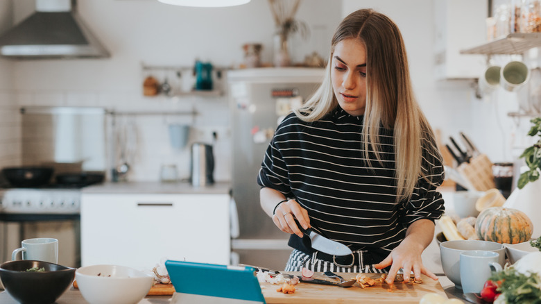 Woman cutting vegetables