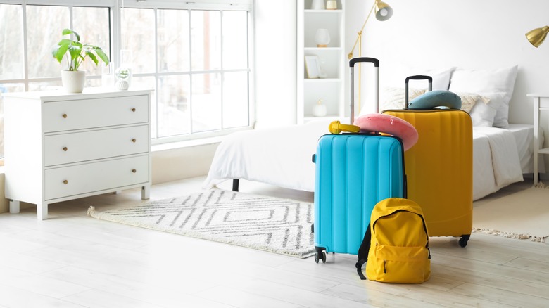 Suitcases in guest bedroom