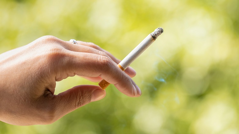 Woman holding cigarette