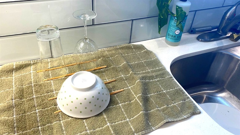 Dishes drying on dish towel