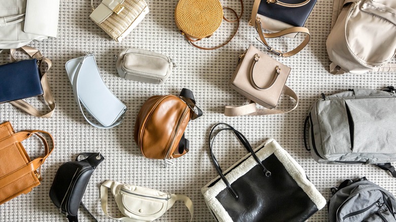 A selection of handbags scattered on the floor