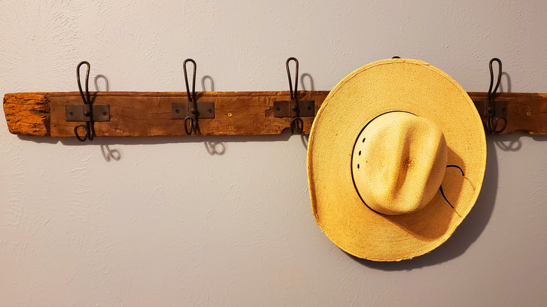 wooden wall rack with hat