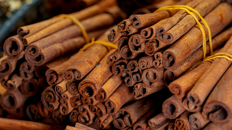 several piles of cinnamon sticks 