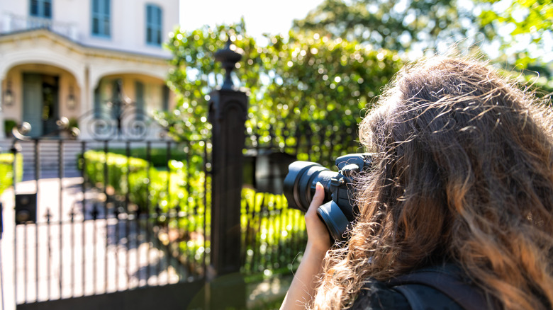 woman photographing home