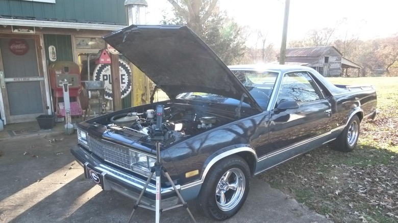 HF96V on tripod in front of El Camino with open hood