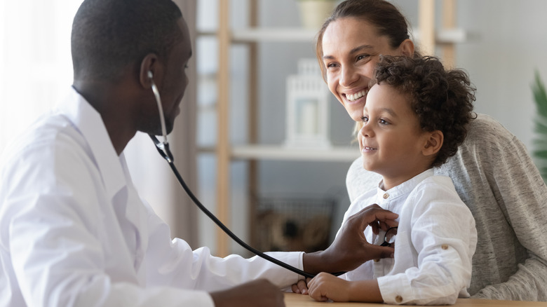 doctor checking heart and lungs