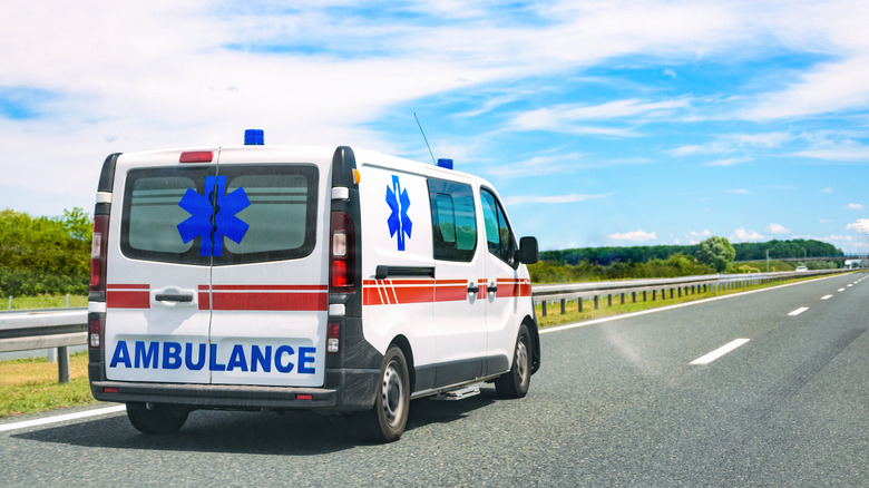 ambulance driving down road