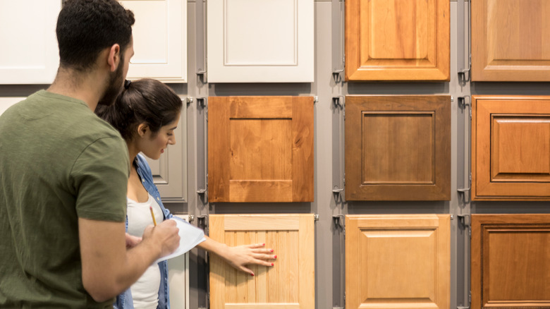 Person choosing cabinets