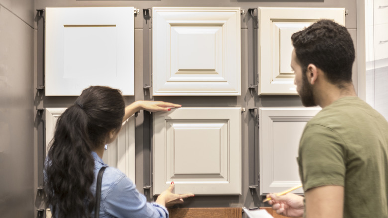 People checking cabinet sample