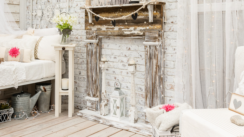 A faux fireplace with a lantern on it