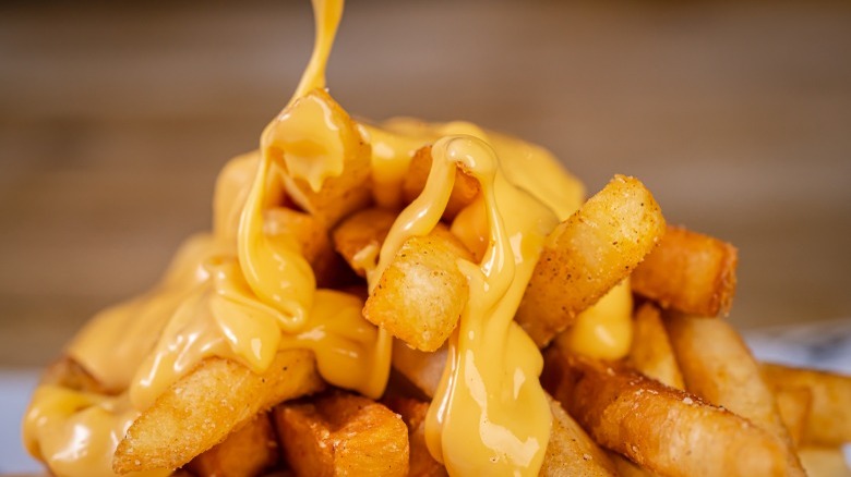 French fries with melted cheese 