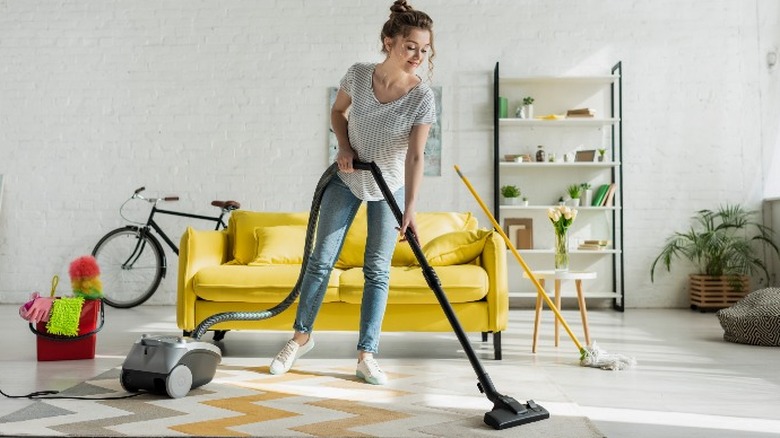 woman with vacuum cleaner