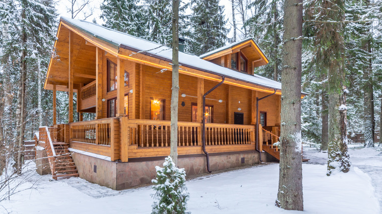 Winter cabin in snow