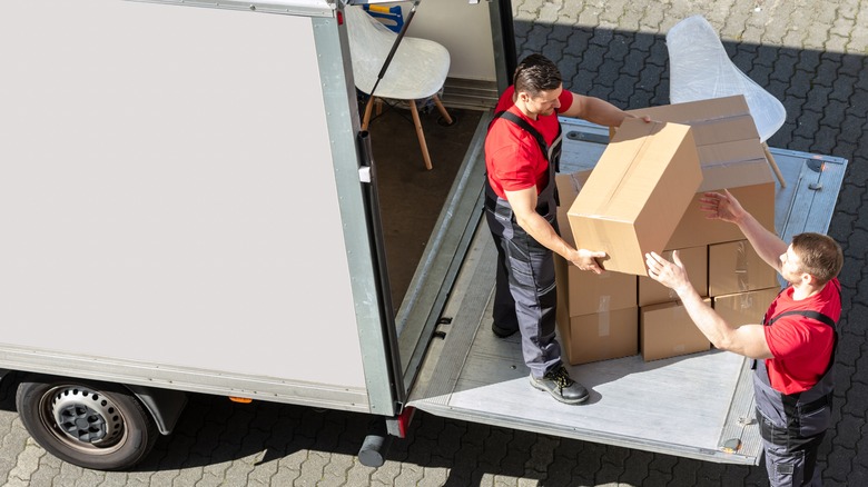 Movers packing moving truck