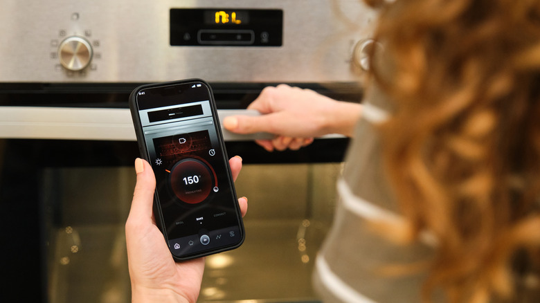 close up of person using a smart home touchscreen console