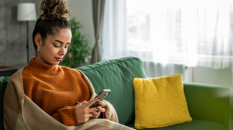 woman using phone in home