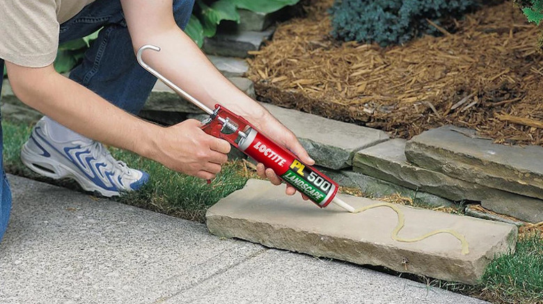 Applying Loctite PL500 to stone