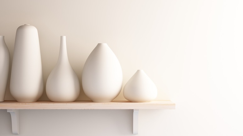 Different shaped white vases