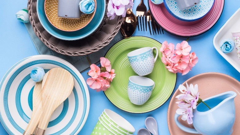 Mismatched plates on blue table