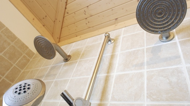 three showerheads on wall