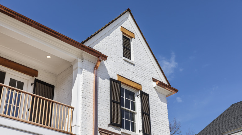 copper gutters on brick house