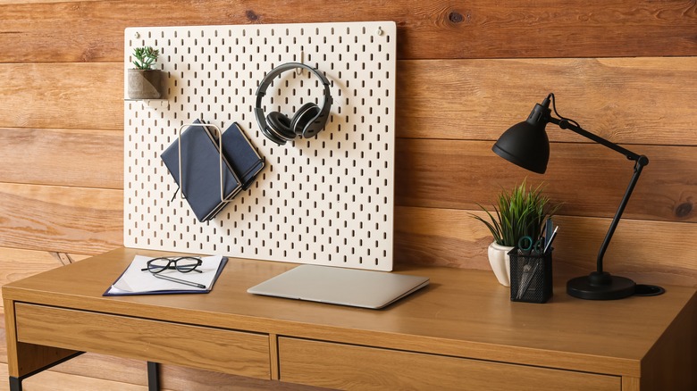 pegboard propped up behind desk