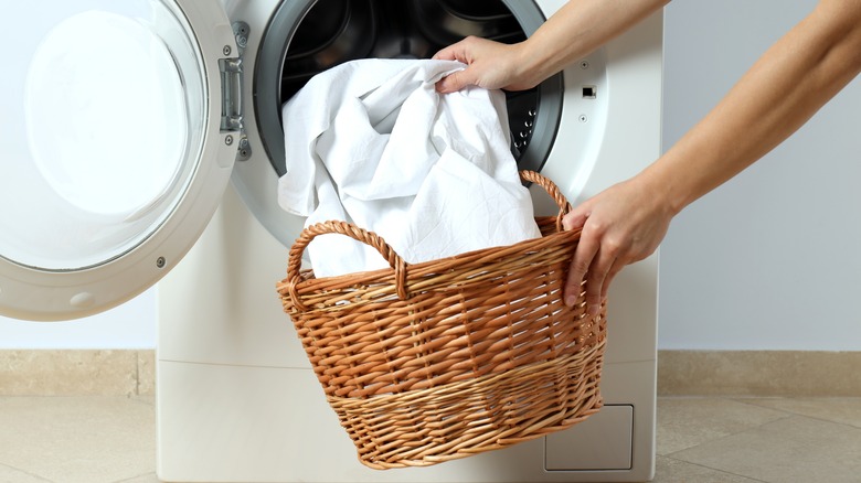 Putting sheets in washing machine