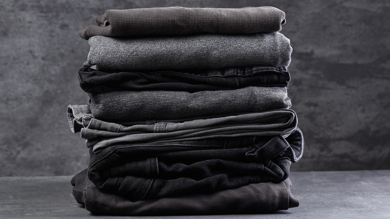 Stack of folded dark clothing