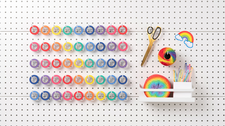 Pegboard with craft supplies on hooks