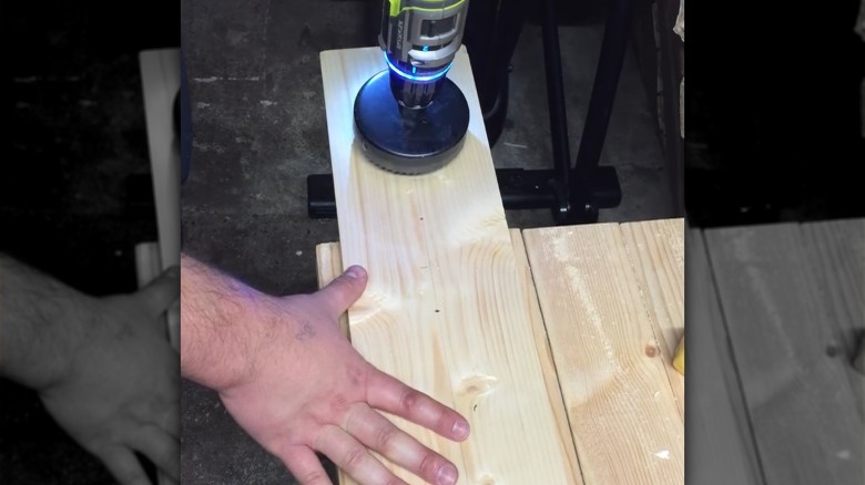 Hole saw drilling through board