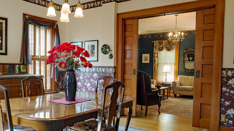 Victorian dining room and sitting room separated by double pocket doors