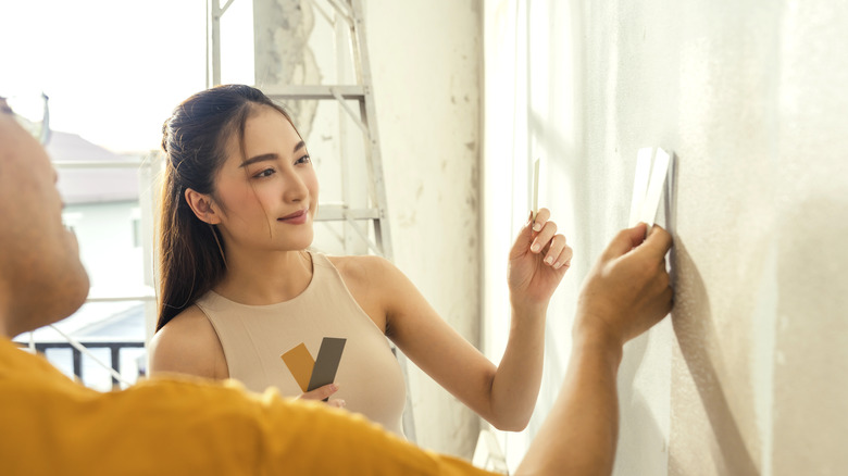 Woman looking at paint swatches