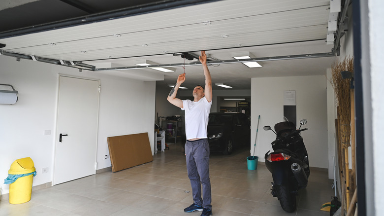 Man working on garage door