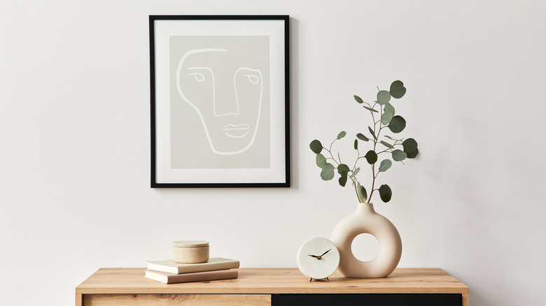 Vase of eucalyptus on table
