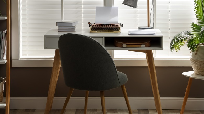 A desk in front of a window